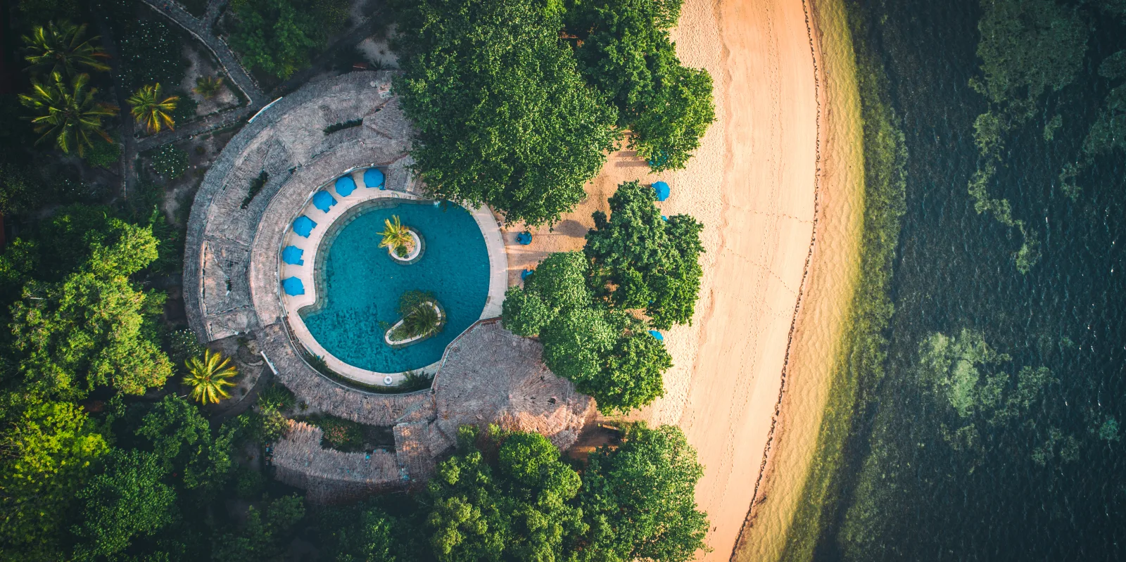 The resort pool and beach from above