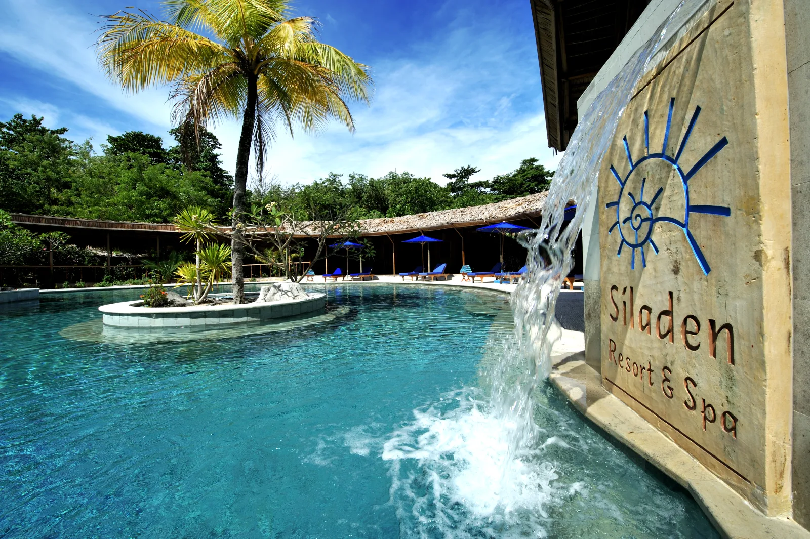 The resort pool with the Siladen Resort & Spa sign