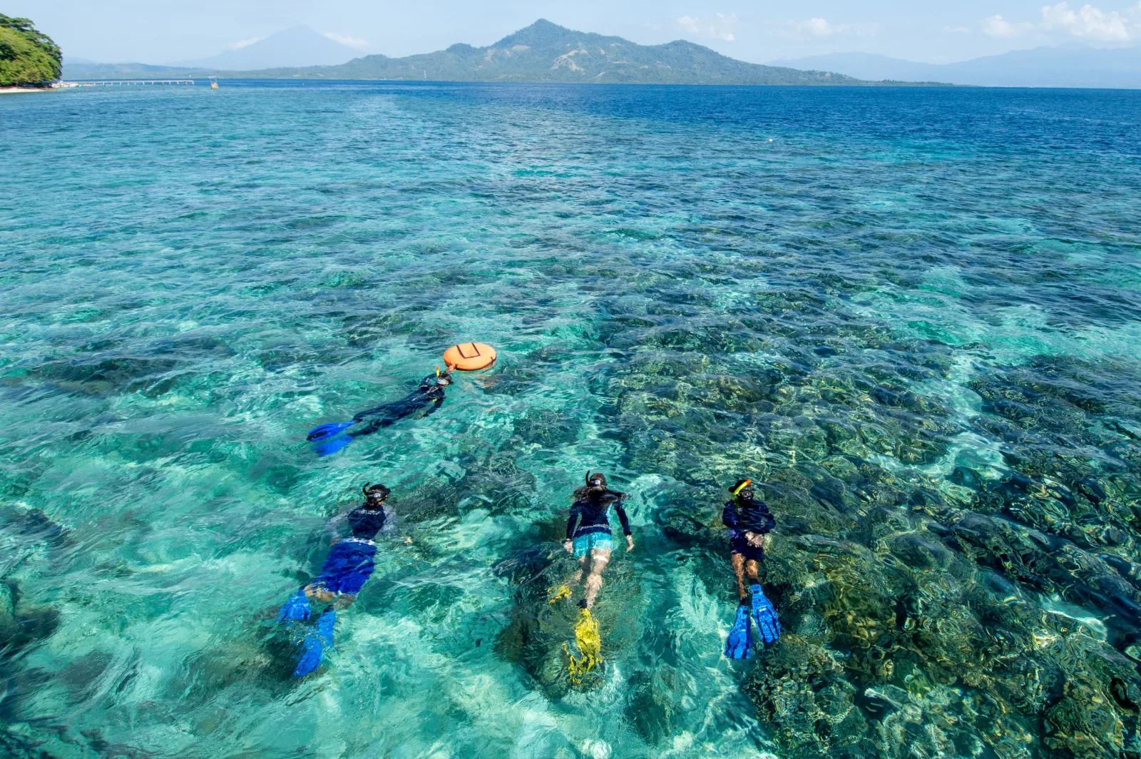 Snorkellers over the shallow reef