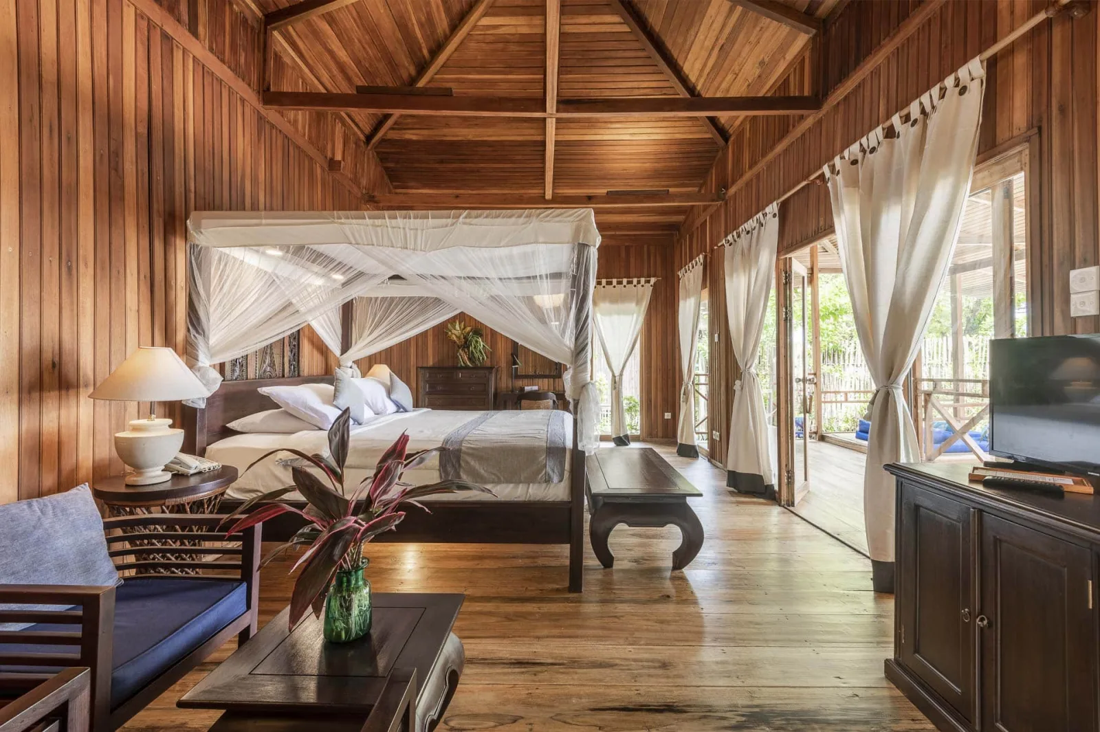 Villa bedroom with wooden walls