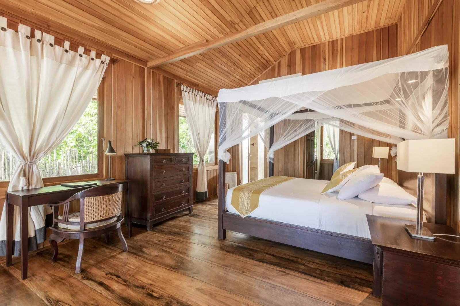 Bedroom with a draped four-poster bed