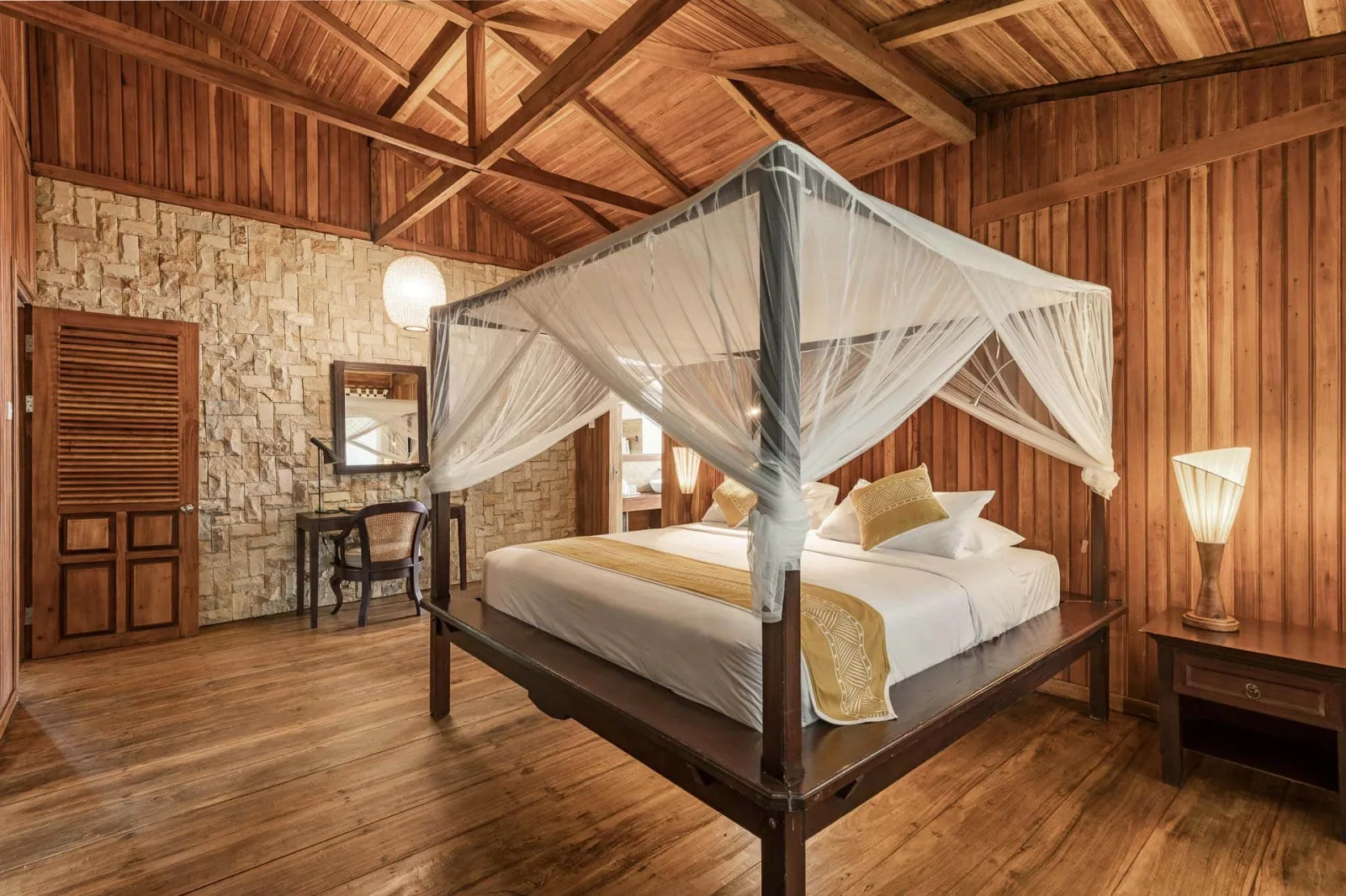 Bedroom with a draped four-poster bed