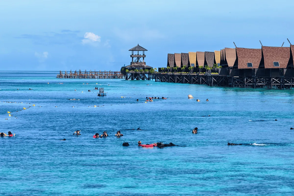 Snorkellers by the resort walkways