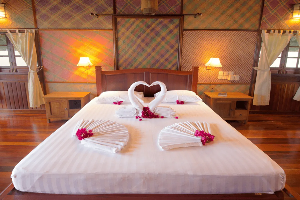 Bed decorated with towel swans