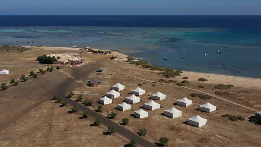 Rows of royal tents on the shore from above