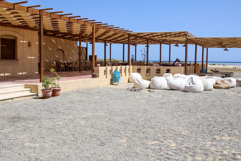 Terrace with bean bag chairs by the sea