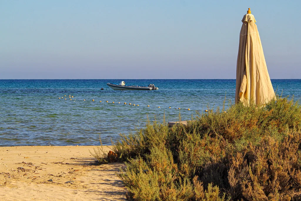 The village beach with a parasol